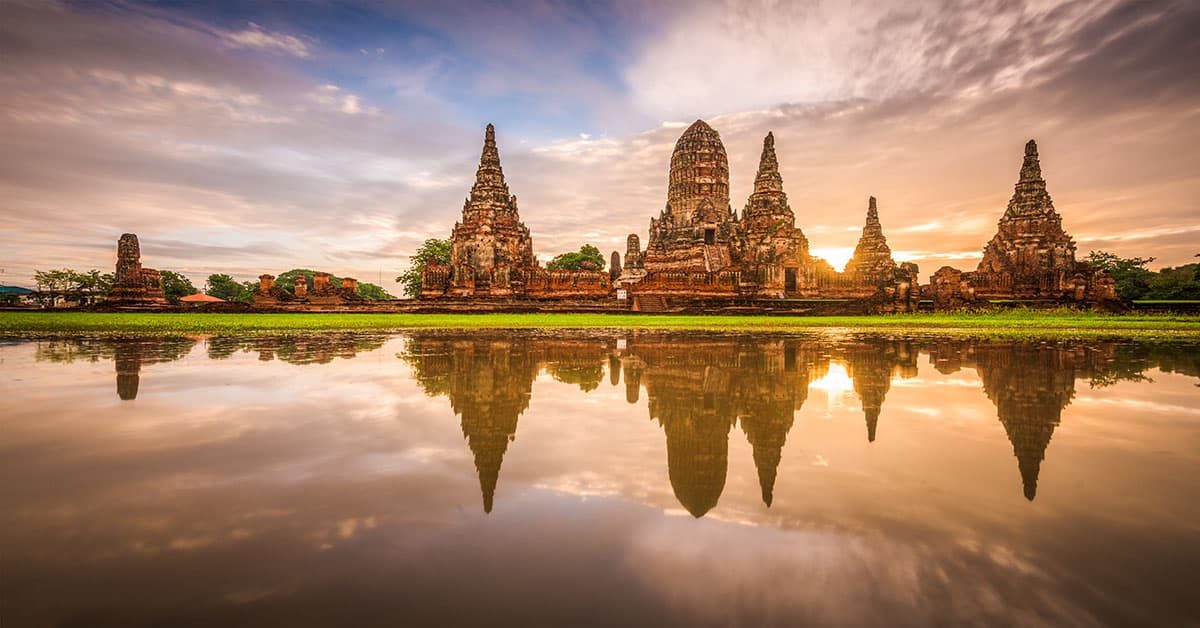 A beautiful reflection of the ruined temples in Ayutthaya during the sunset.